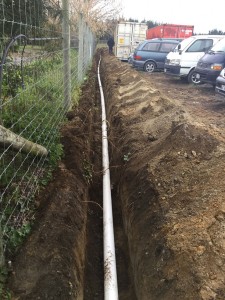 Piping laid down dug out trench